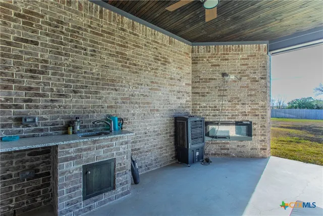 a brick oven with fireplace a sink