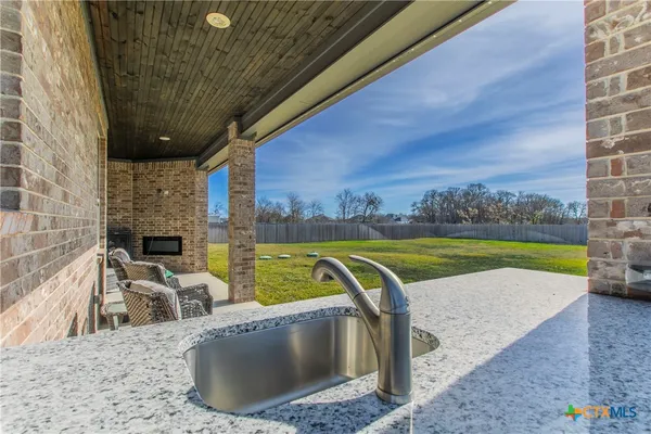 a view of a swimming pool with a lounge chair