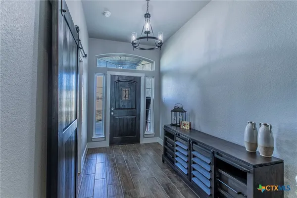 a very nice looking room with wooden floor