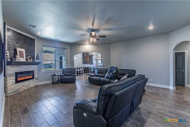 a living room with furniture and a fireplace
