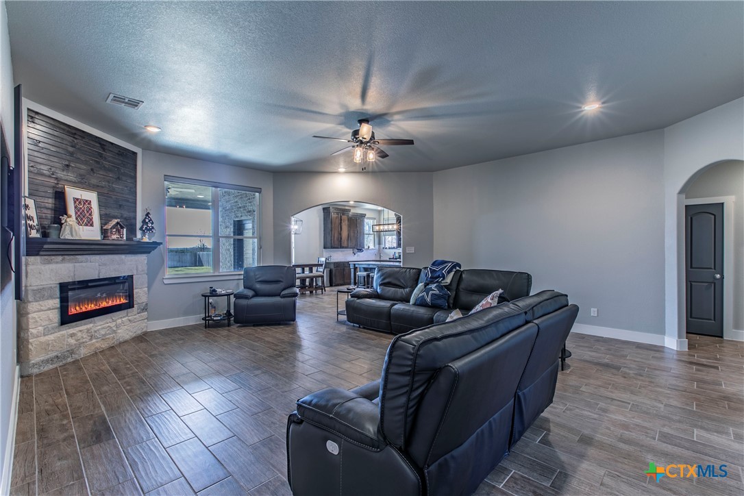 8323 Torrente Drive Temple, TX 76504 - Photo 9 of 30 a living room with furniture and a fireplace