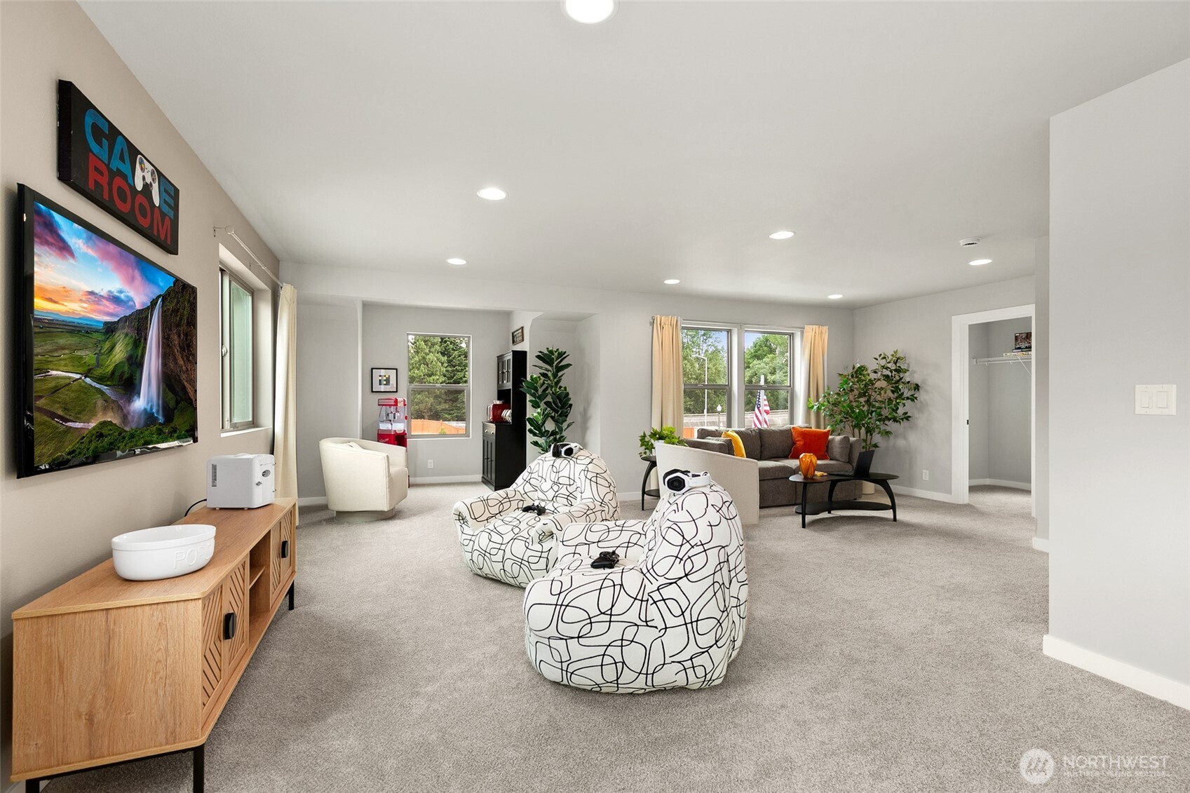 12506 Southeast 256th Place, Unit 8 Kent, WA 98030 - Photo 21 of 26 a living room with furniture and a flat screen tv