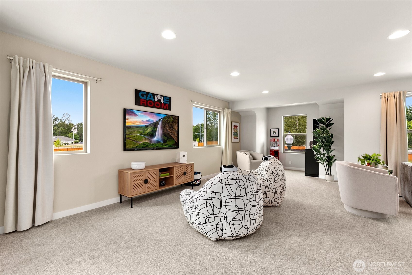 12506 Southeast 256th Place, Unit 8 Kent, WA 98030 - Photo 22 of 26 a living room with furniture and a flat screen tv