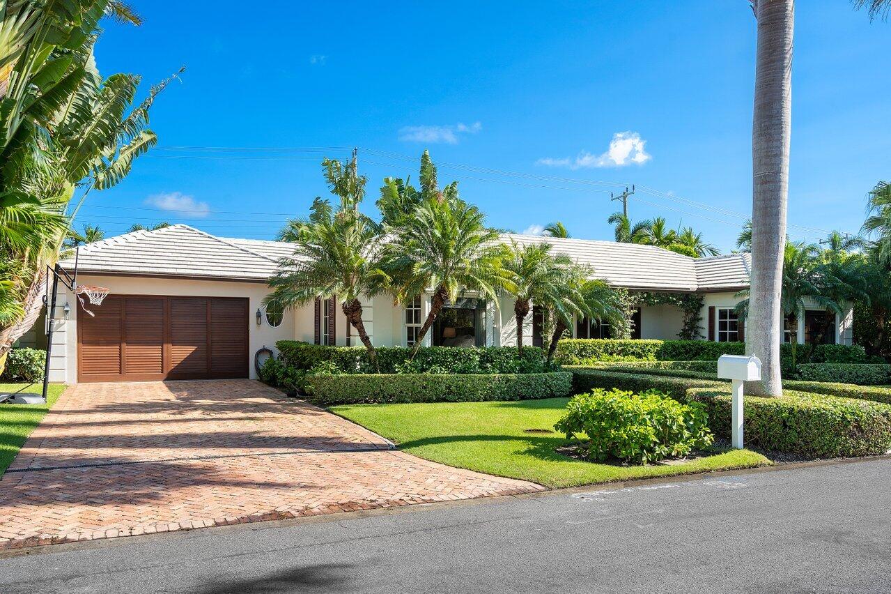 265 List Road Palm Beach, FL 33480 - Photo 1 of 38 a front view of a house with a yard