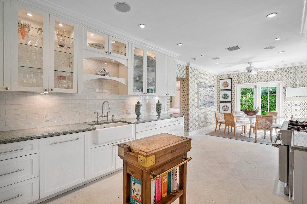 265 List Road Palm Beach, FL 33480 - Photo 15 of 38 a kitchen with furniture and windows