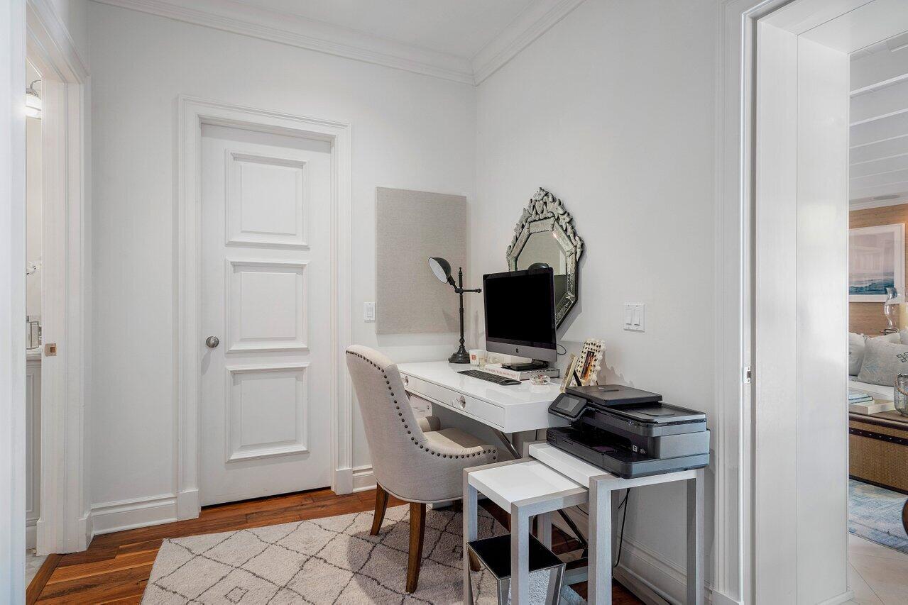 265 List Road Palm Beach, FL 33480 - Photo 18 of 38 a view of a workspace with furniture and wooden floor
