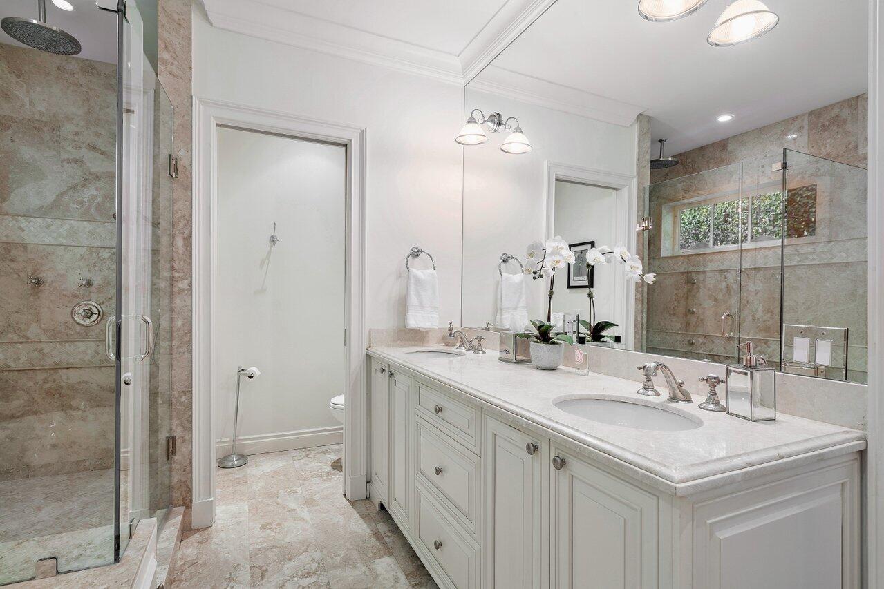 265 List Road Palm Beach, FL 33480 - Photo 20 of 38 a bathroom with a double vanity sink mirror and shower