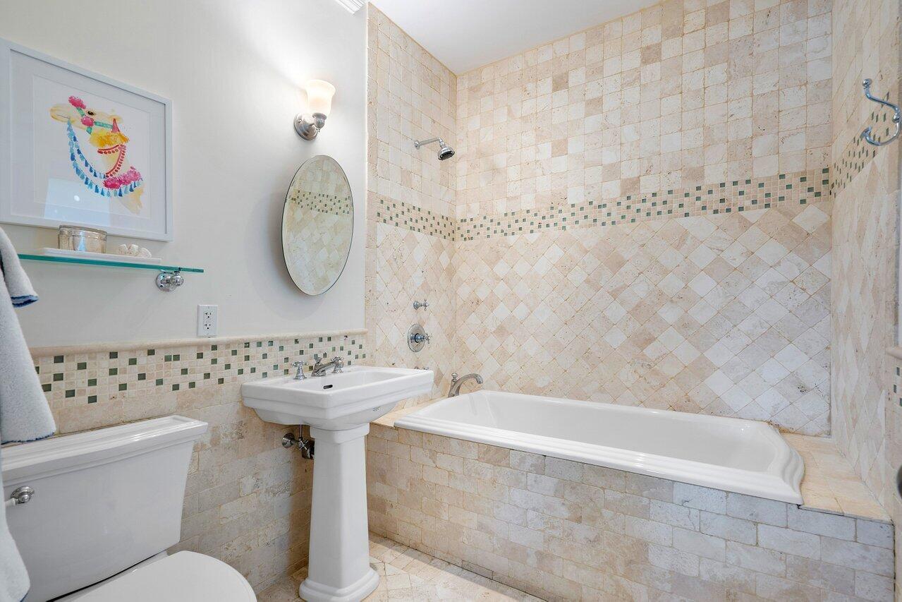 265 List Road Palm Beach, FL 33480 - Photo 22 of 38 a bathroom with a sink a toilet and a bathtub