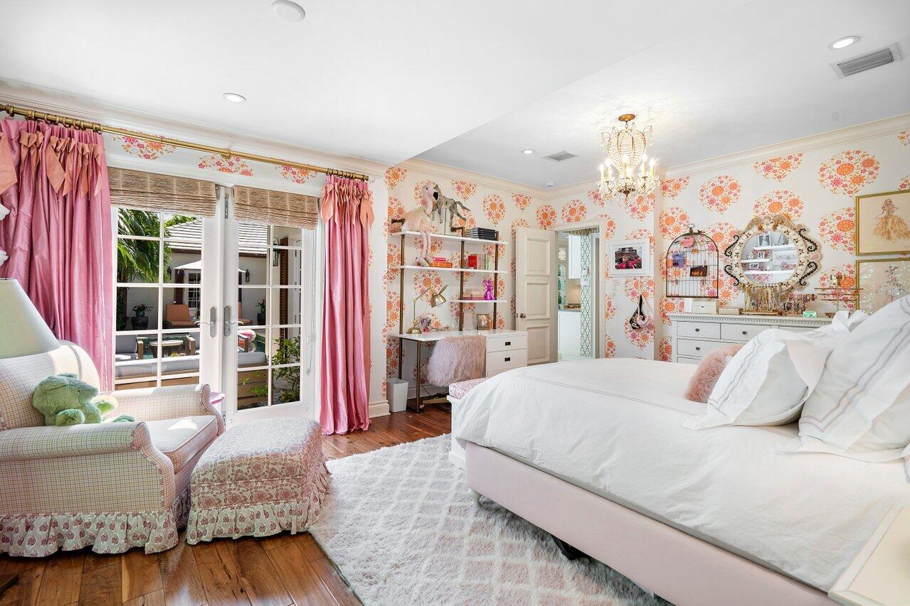 265 List Road Palm Beach, FL 33480 - Photo 24 of 38 a bedroom with a large bed and a couch