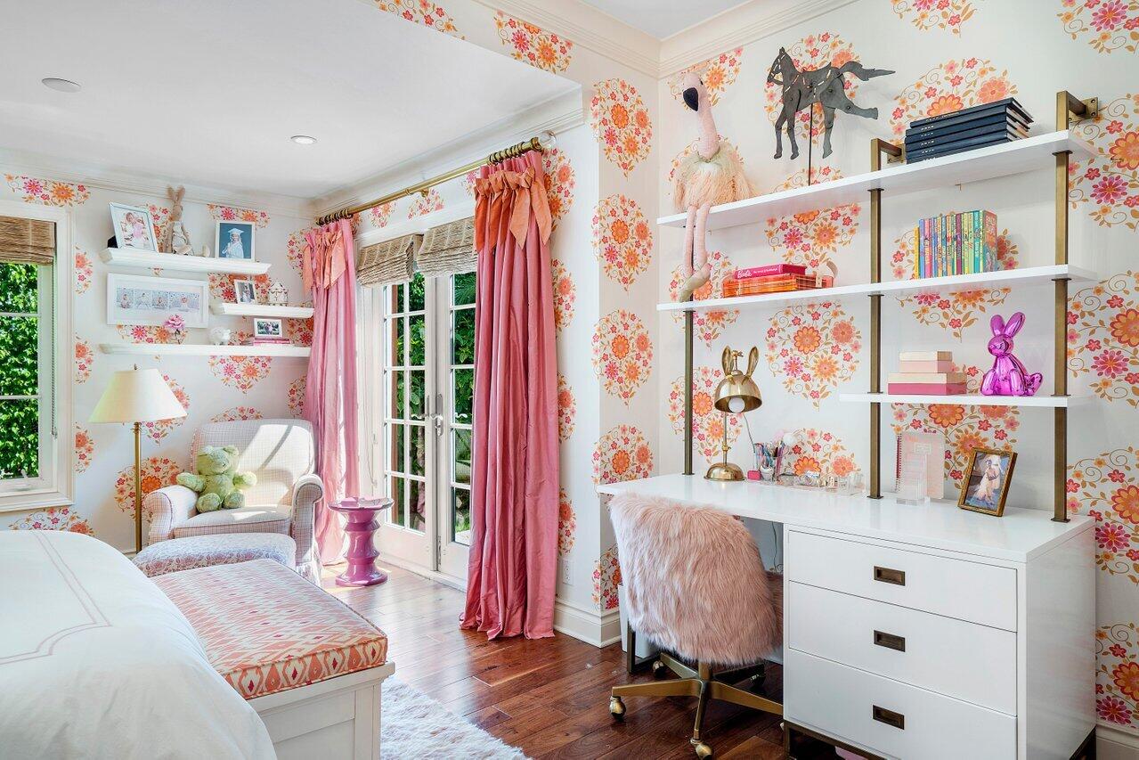 265 List Road Palm Beach, FL 33480 - Photo 25 of 38 a bed room with a bed and a book shelf