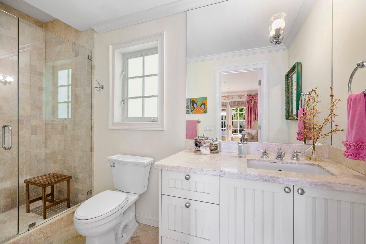 265 List Road Palm Beach, FL 33480 - Photo 26 of 38 a bathroom with a sink toilet vanity and shower