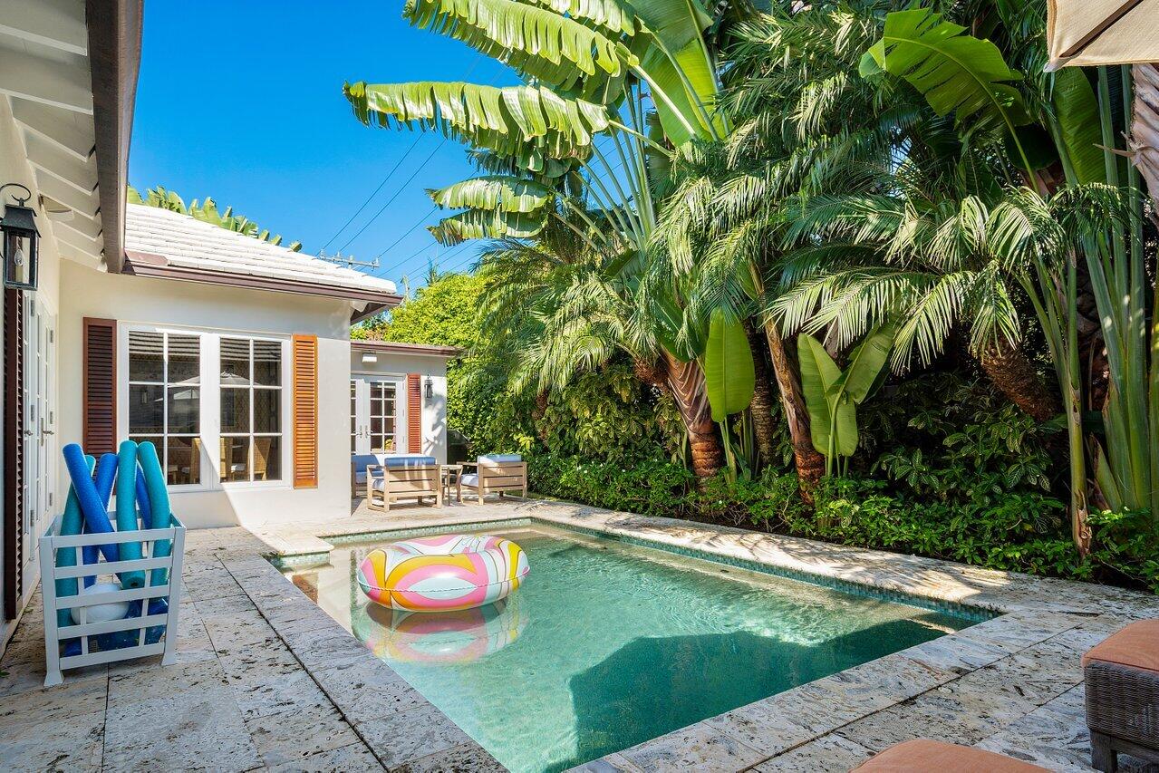 265 List Road Palm Beach, FL 33480 - Photo 31 of 38 a view of a house with swimming pool and sitting area