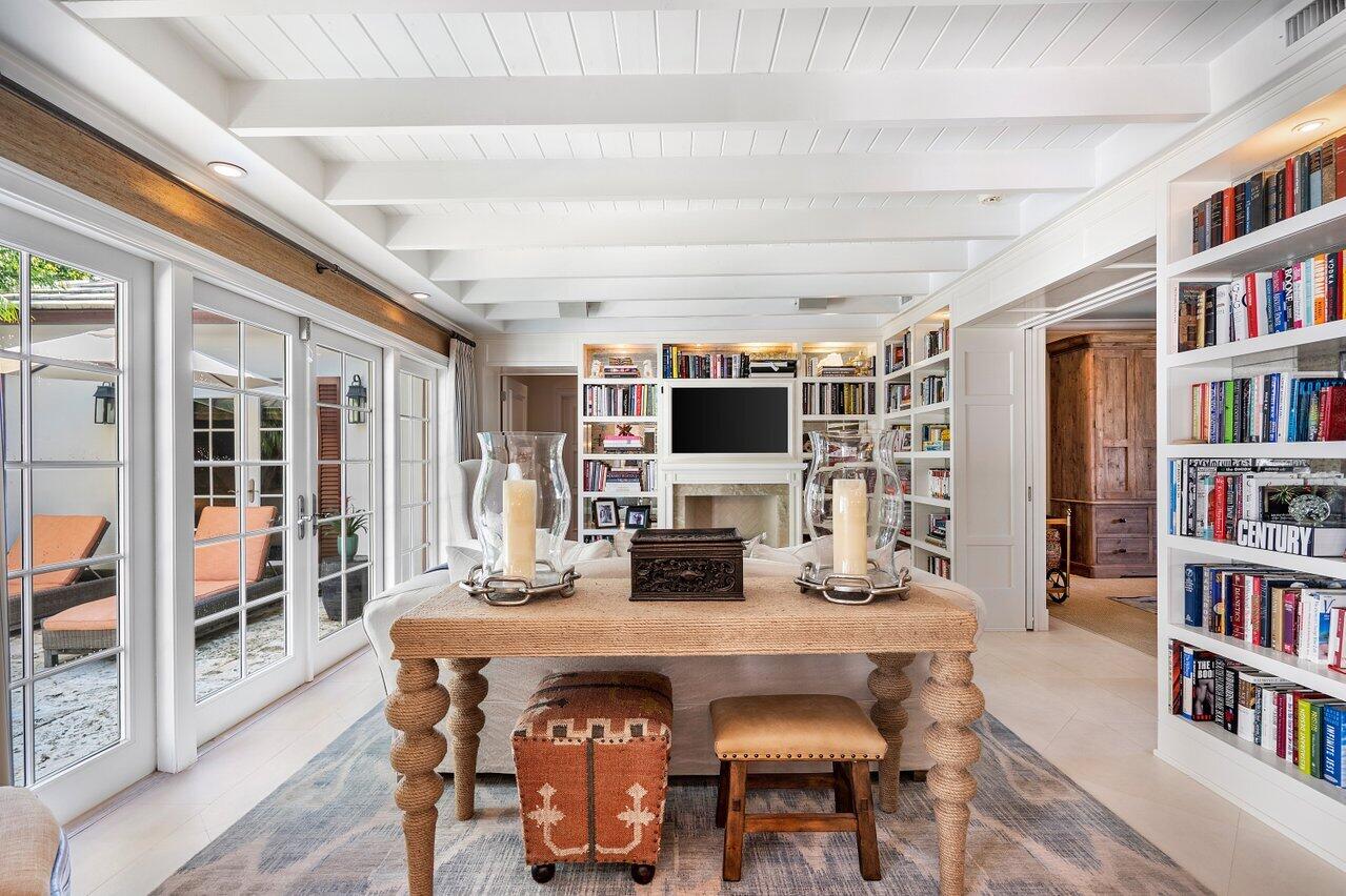 265 List Road Palm Beach, FL 33480 - Photo 8 of 38 a dining room with furniture and a book shelf