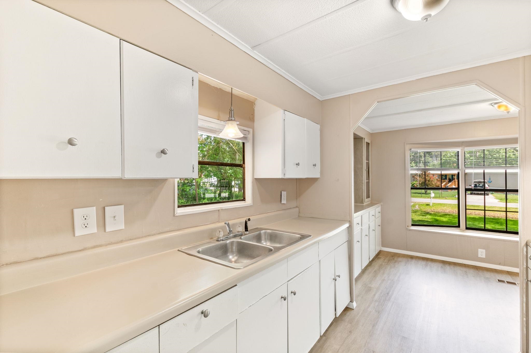 4541 Fourth Avenue St. Augustine, FL 32095 - Photo 13 of 32 a kitchen with a sink and a window