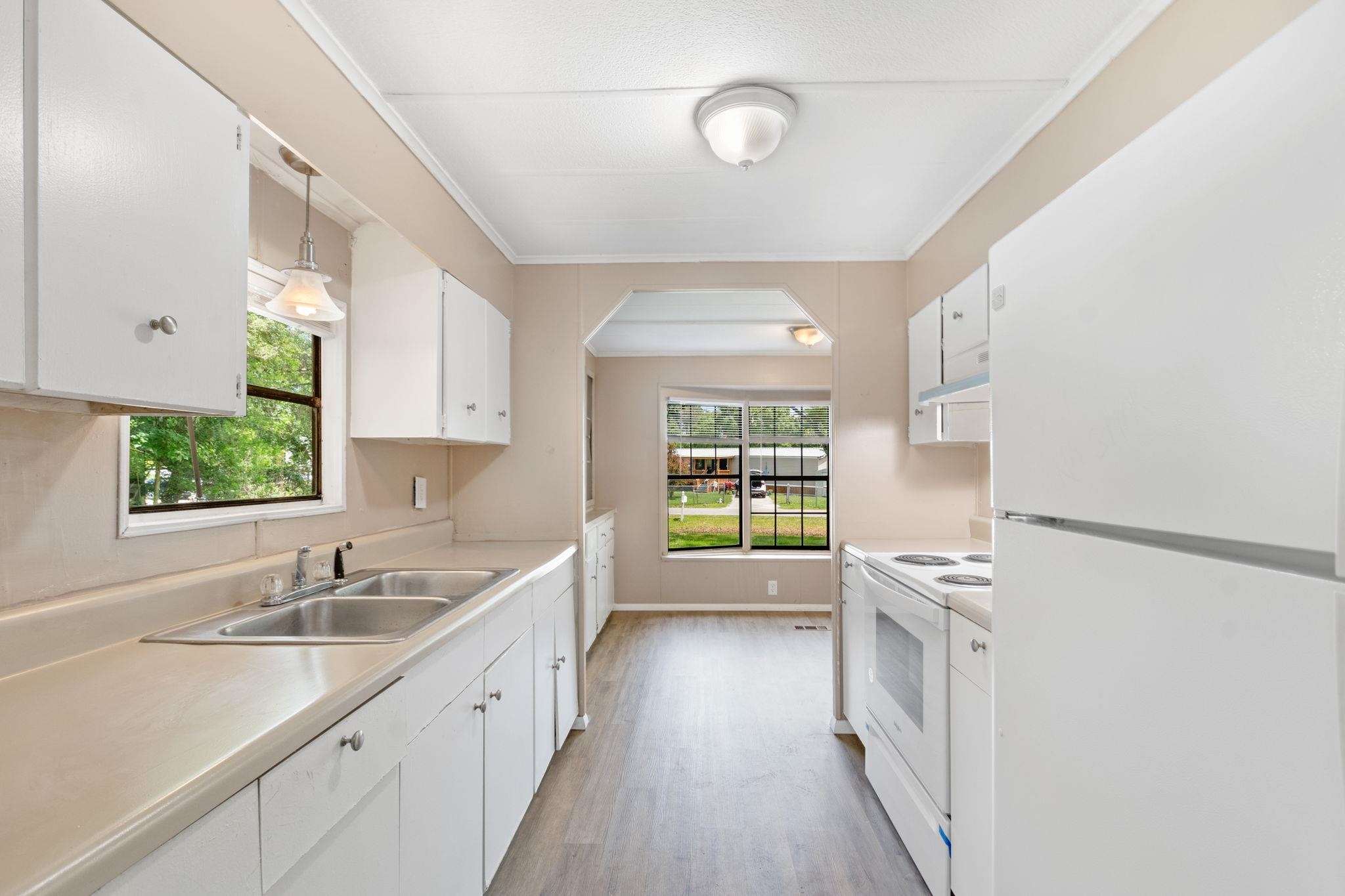 4541 Fourth Avenue St. Augustine, FL 32095 - Photo 14 of 32 a kitchen with a sink and a large window