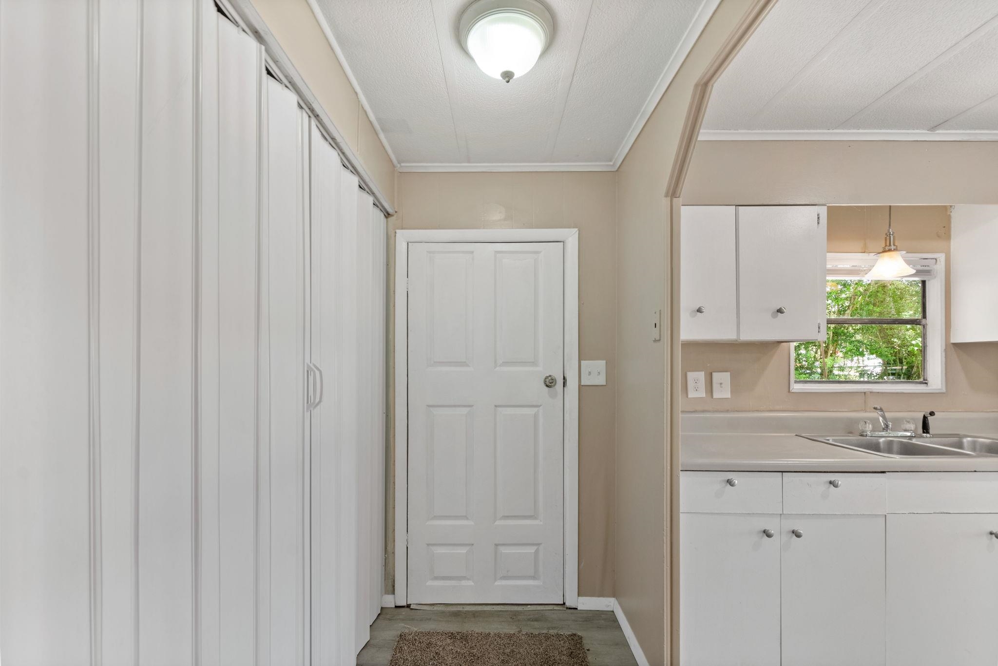 4541 Fourth Avenue St. Augustine, FL 32095 - Photo 18 of 32 a bathroom with a sink and a window