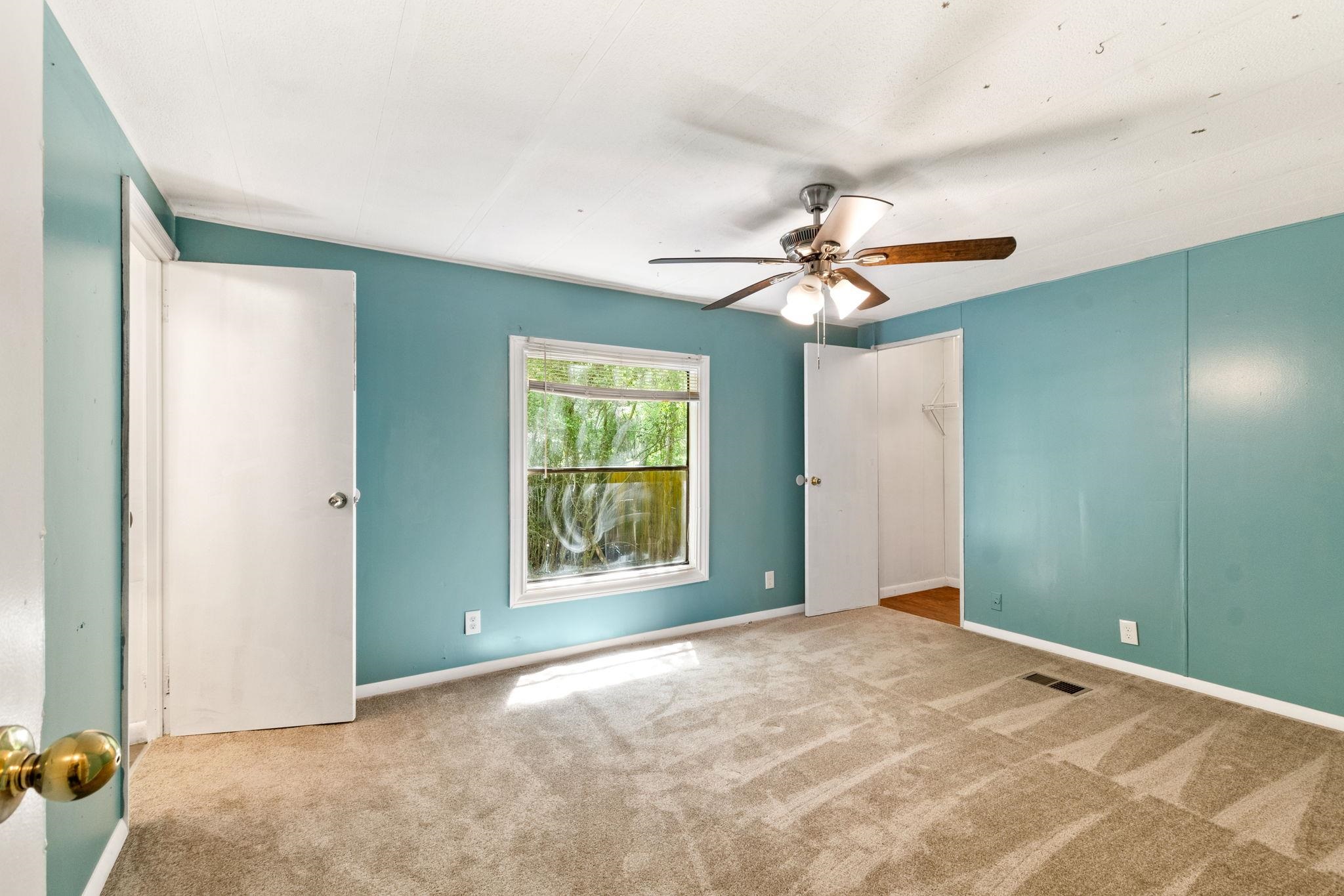 4541 Fourth Avenue St. Augustine, FL 32095 - Photo 20 of 32 a view of a room with a ceiling fan and a window
