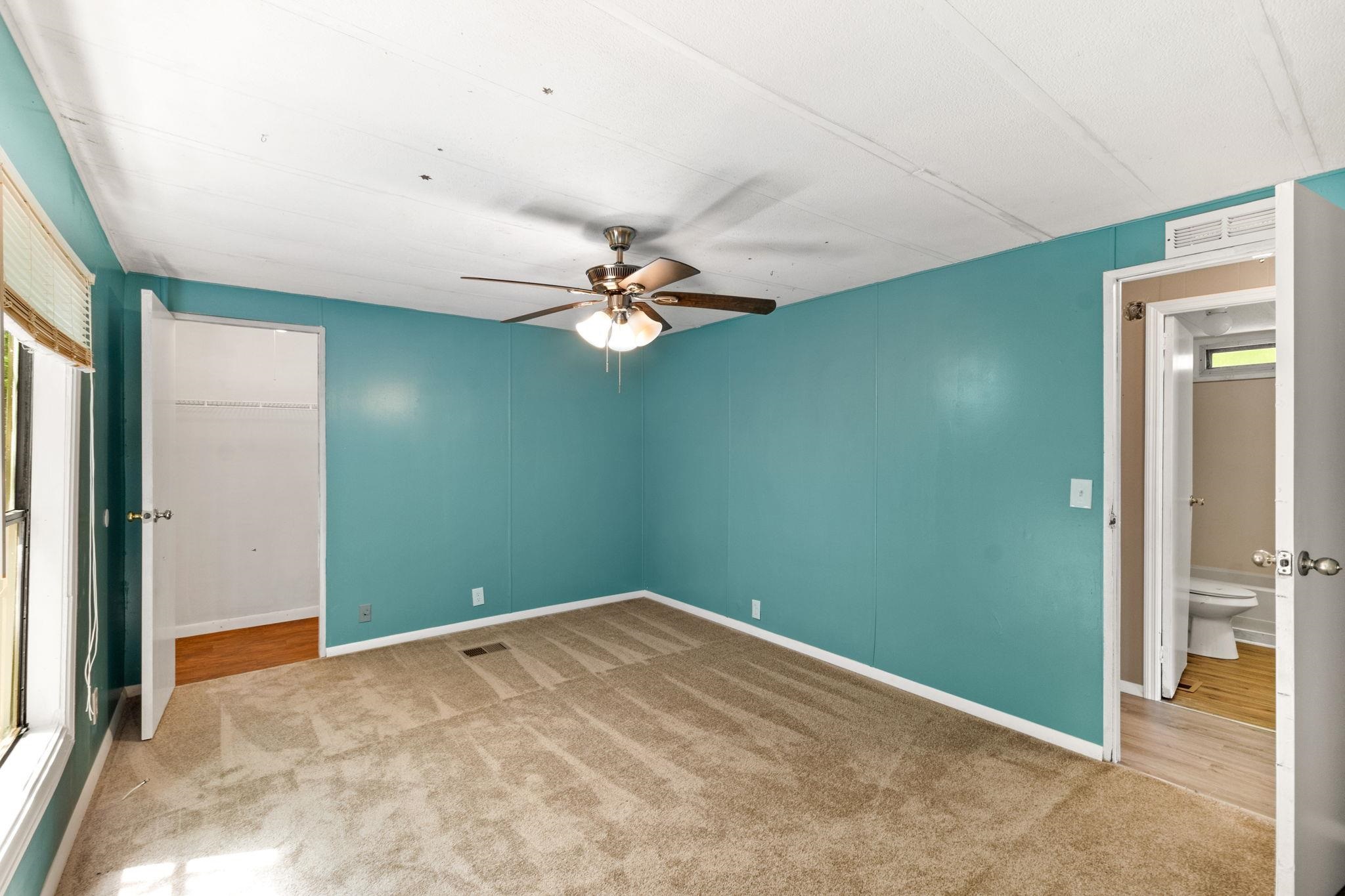 4541 Fourth Avenue St. Augustine, FL 32095 - Photo 21 of 32 an empty room with closet and a chandelier fan