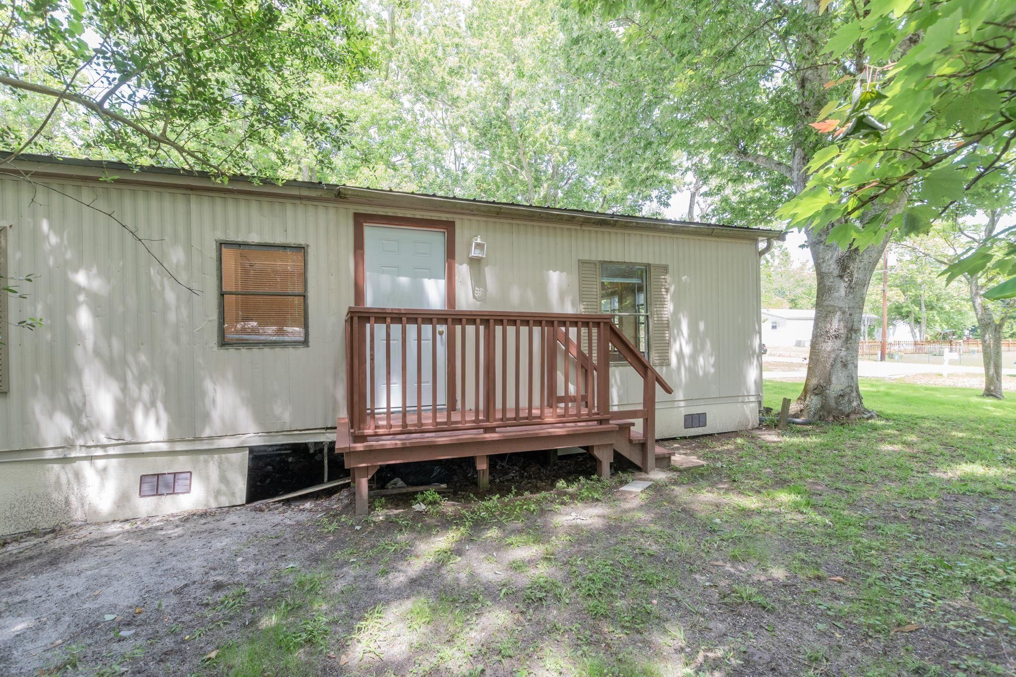 4541 Fourth Avenue St. Augustine, FL 32095 - Photo 27 of 32 a view of backyard with deck and a small yard