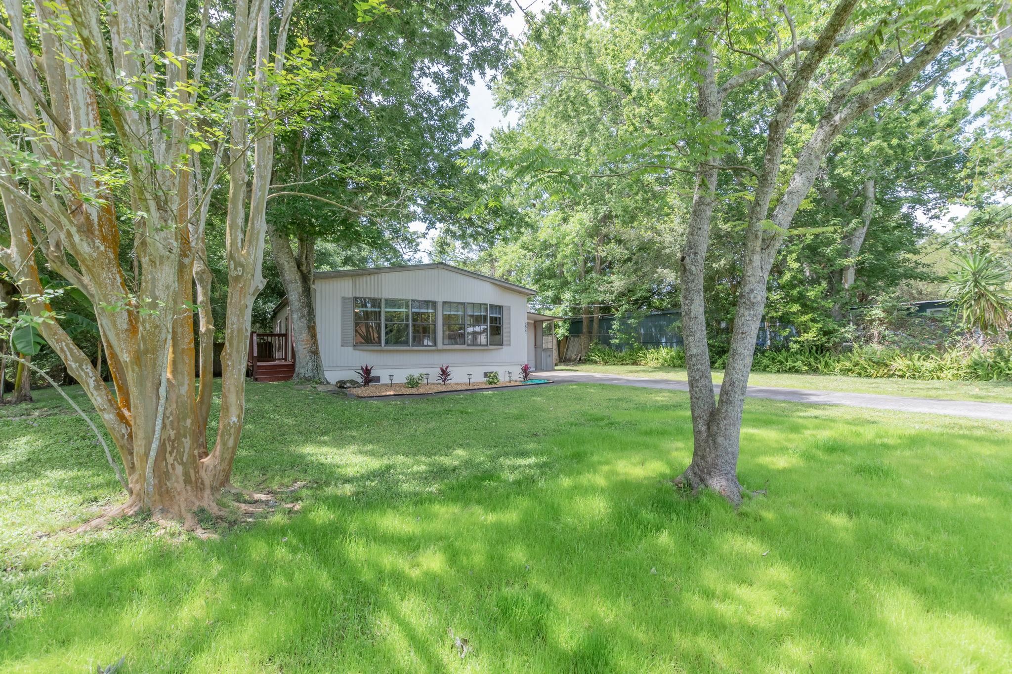 4541 Fourth Avenue St. Augustine, FL 32095 - Photo 4 of 32 a view of a house with backyard and sitting area