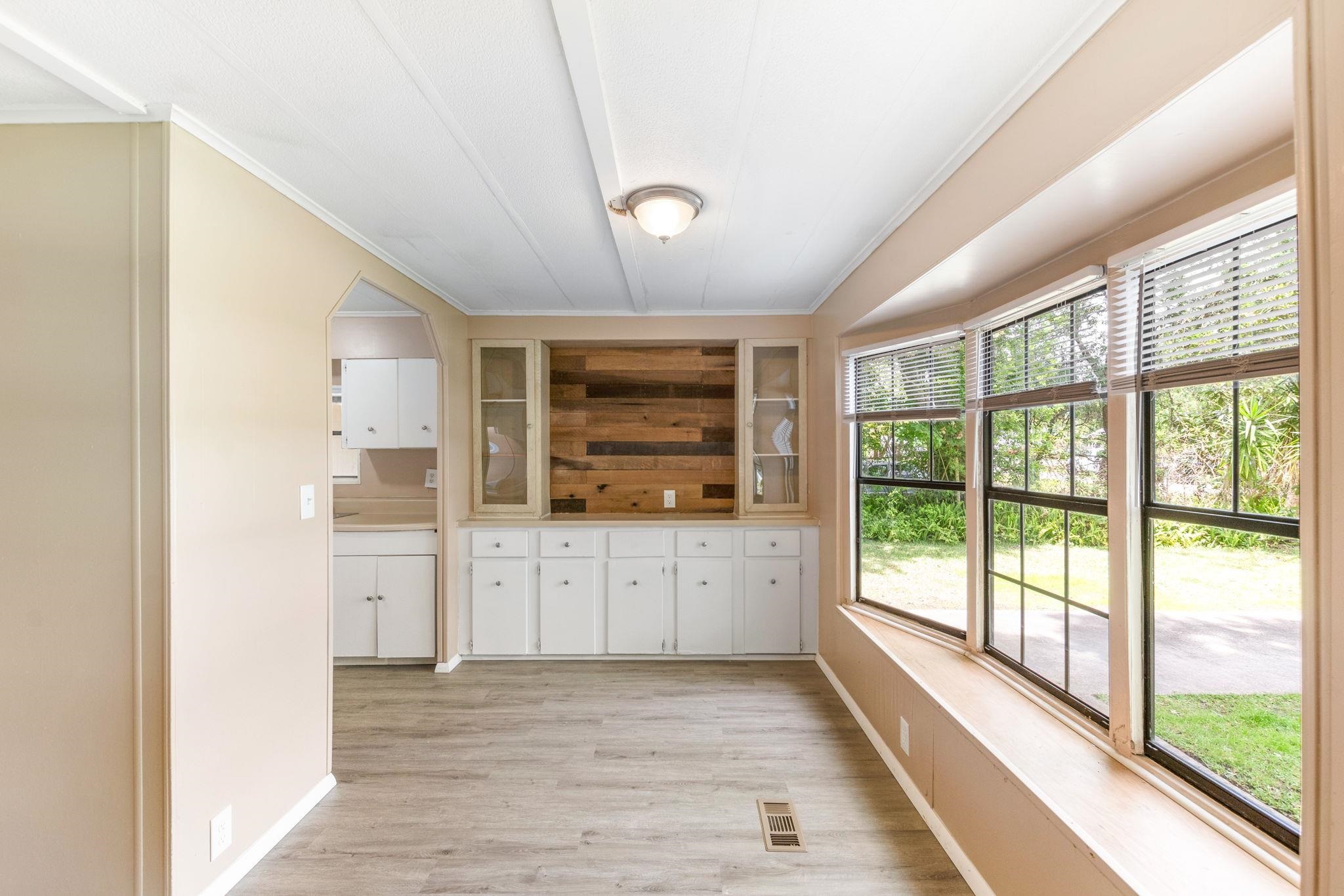 4541 Fourth Avenue St. Augustine, FL 32095 - Photo 10 of 32 a view of a kitchen with a sink wooden cabinets and outdoor view