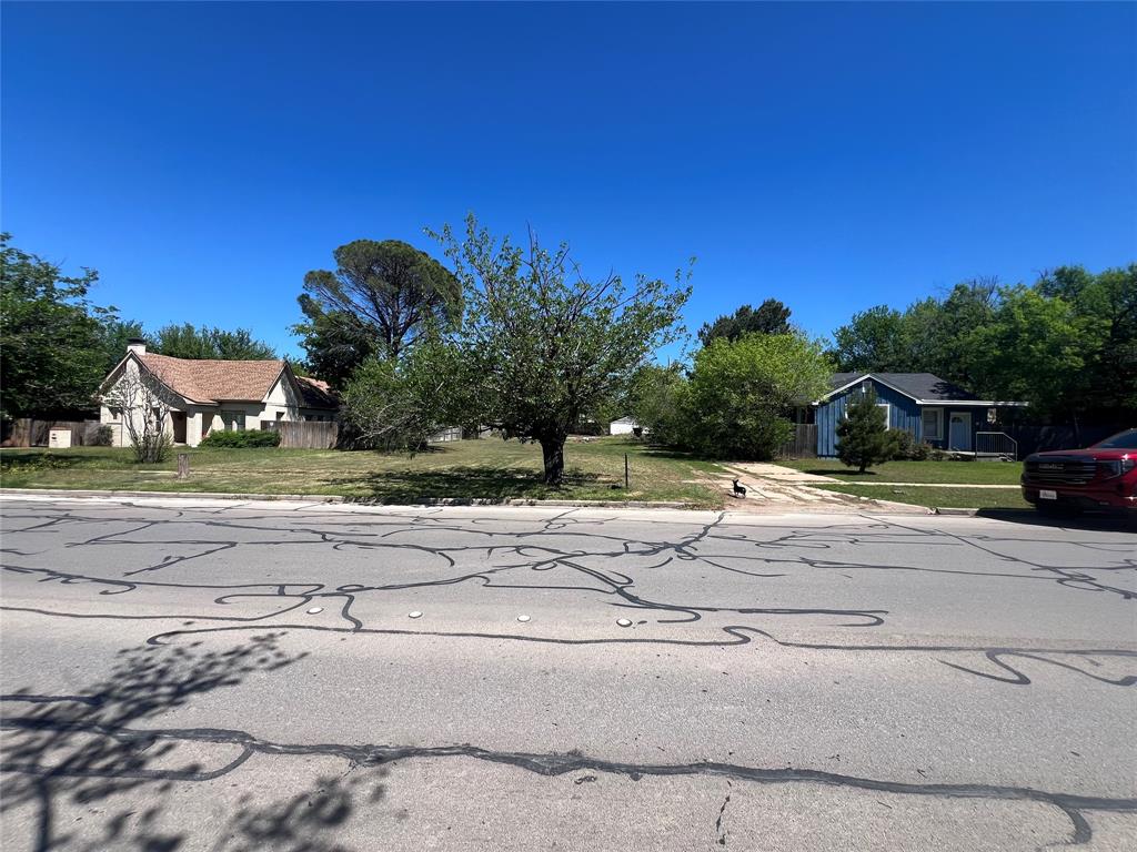 417 Sayles Boulevard Abilene, TX 79605 - Photo 1 of 1 a view of a yard with cars on road