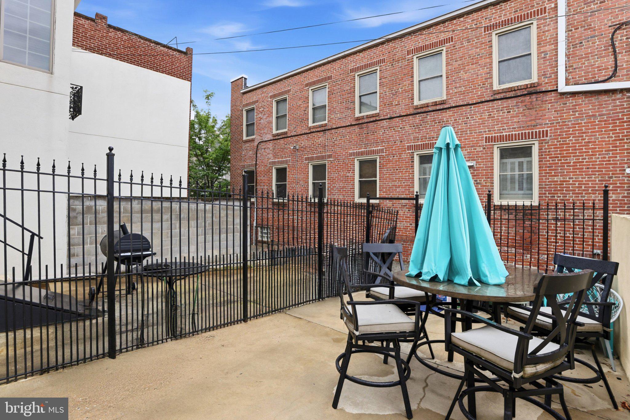 222 South Exeter Street Baltimore, MD 21202 - Photo 32 of 41 a view of a chairs with a small yard
