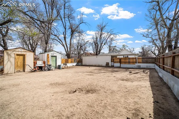 a view of road with large trees