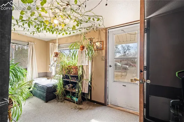a room with window and furniture