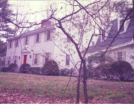 56 Colchester Road Weston, MA 02493 - Photo 1 of 1 a backyard of a house with large trees