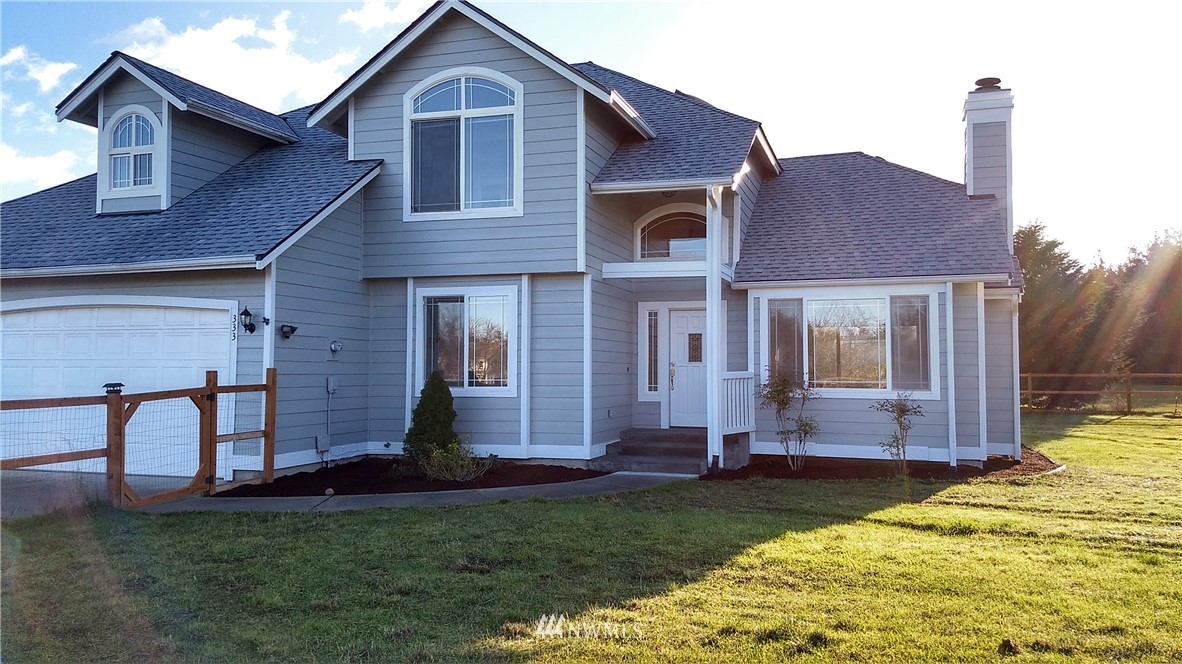 333 Griffith Farm Road Sequim, WA 98382 - Photo 4 of 25 a front view of a house with garden