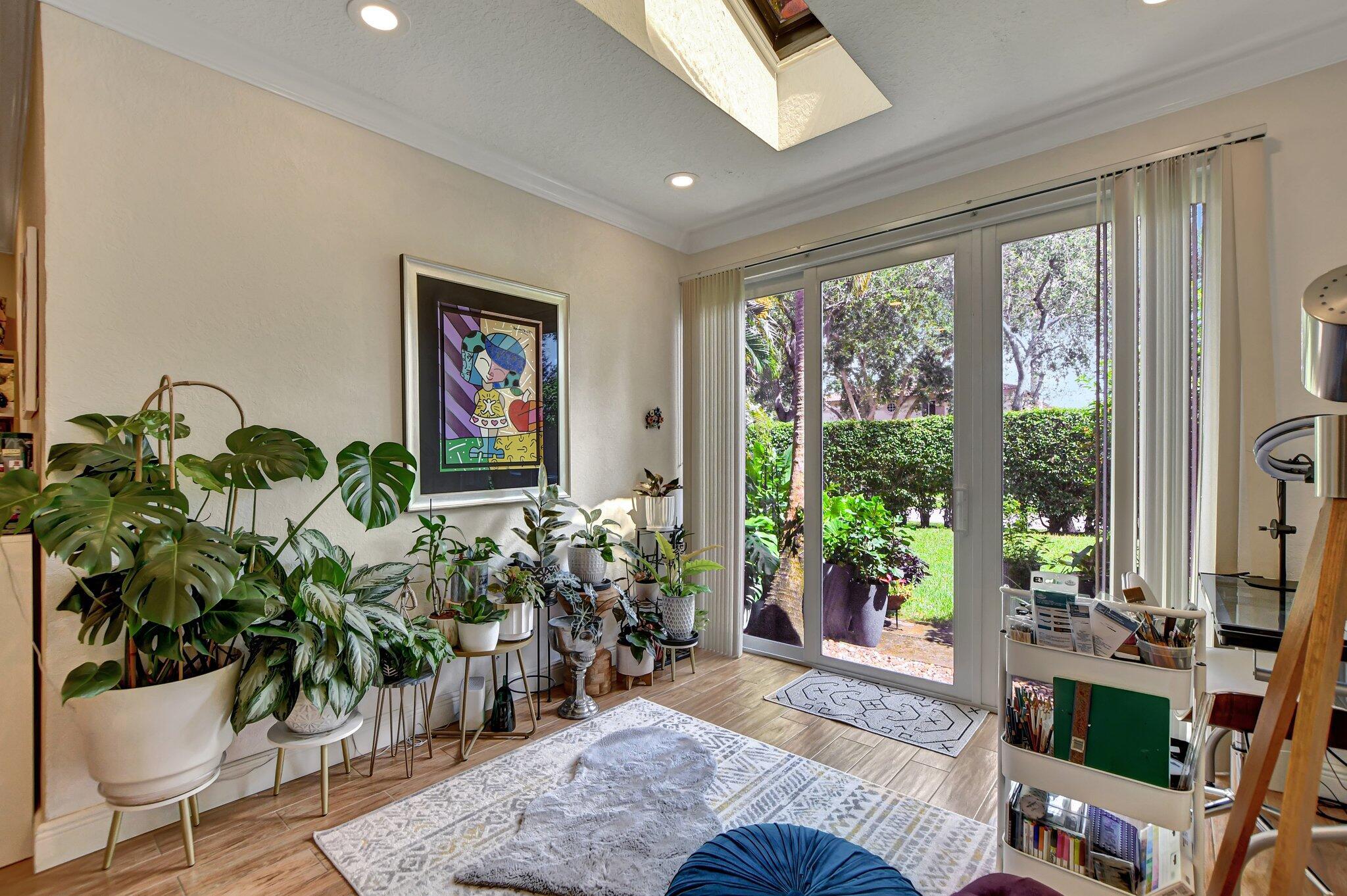 6682 Via Regina Boca Raton, FL 33433 - Photo 4 of 46 a living room with furniture and a potted plant