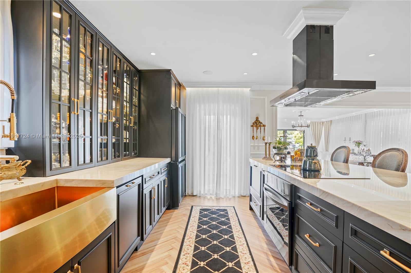 1625 Daytonia Road Miami Beach, FL 33141 - Photo 13 of 39 a kitchen with stainless steel appliances a sink stove and cabinets