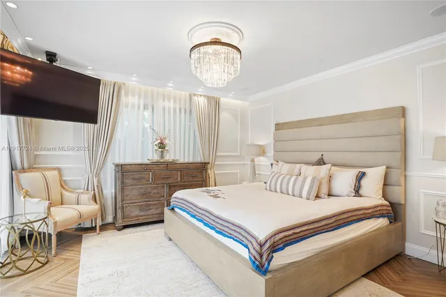 a bed room with a bed and a chair