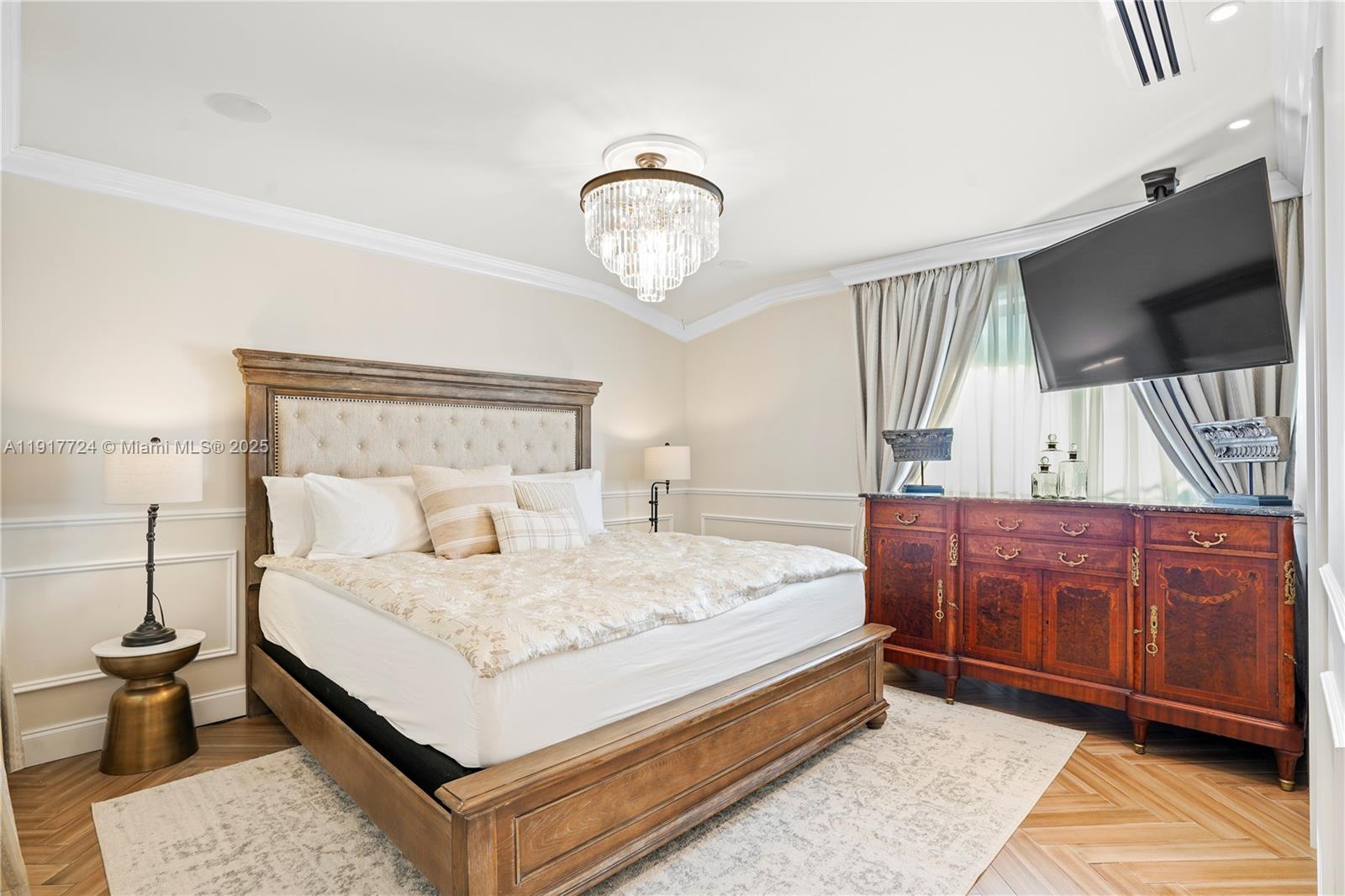 1625 Daytonia Road Miami Beach, FL 33141 - Photo 17 of 39 a bedroom with a large bed and a dresser