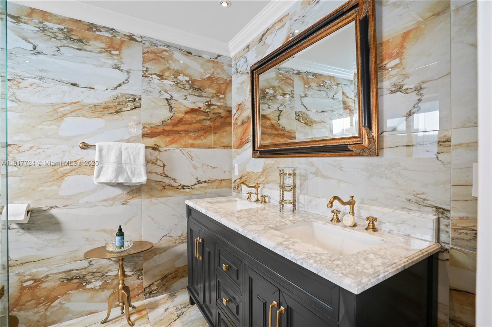 1625 Daytonia Road Miami Beach, FL 33141 - Photo 18 of 39 a bathroom with a granite countertop sink and a window