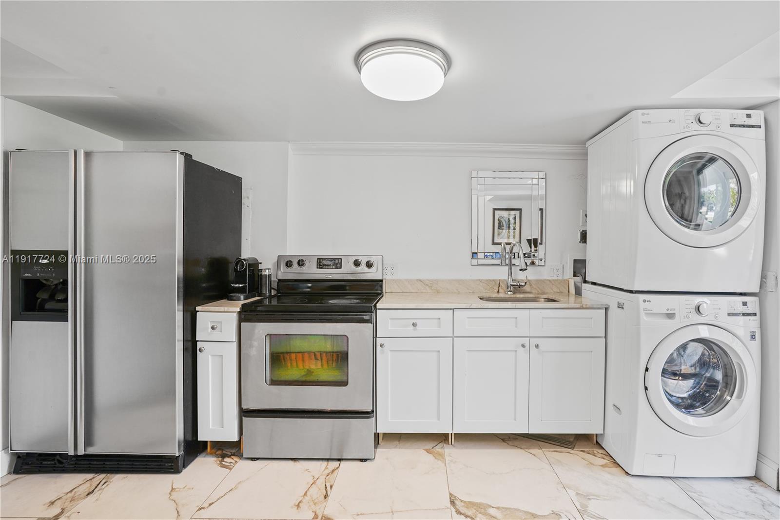 1625 Daytonia Road Miami Beach, FL 33141 - Photo 25 of 39 a utility room with sink washer and dryer