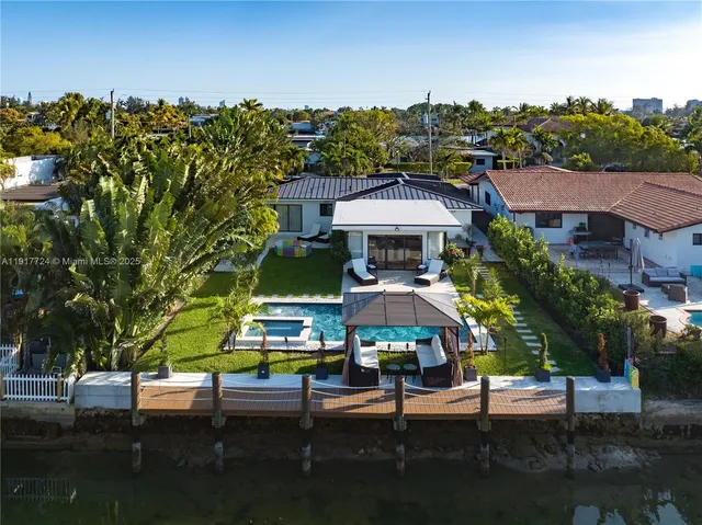 a view of a chairs and table in the patio