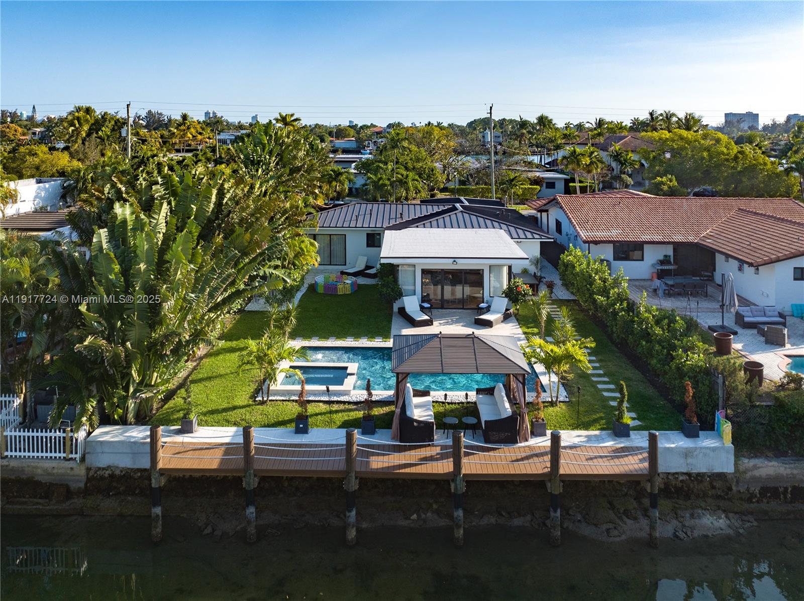 1625 Daytonia Road Miami Beach, FL 33141 - Photo 32 of 39 a view of a chairs and table in the patio
