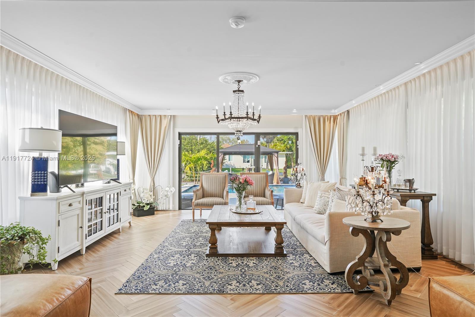 1625 Daytonia Road Miami Beach, FL 33141 - Photo 9 of 39 a living room with furniture and a large window
