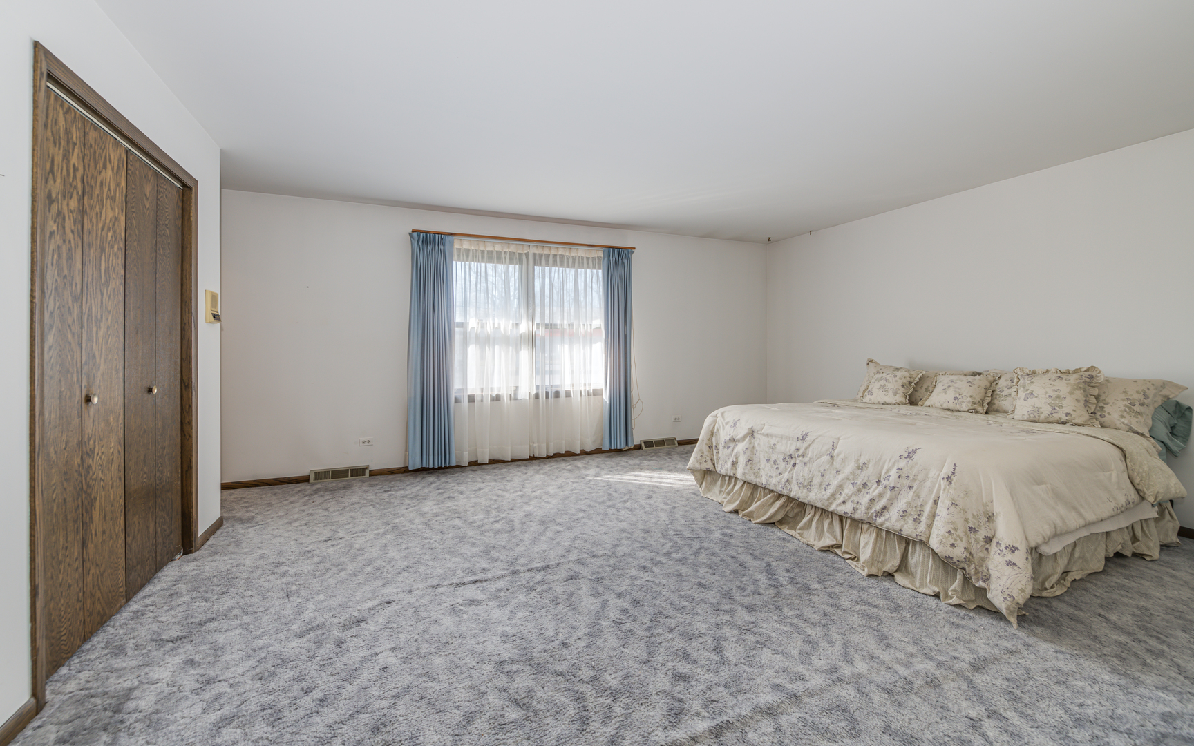 14400 Shepard Drive Dolton, IL 60419 - Photo 20 of 55 a spacious bedroom with a bed and a window