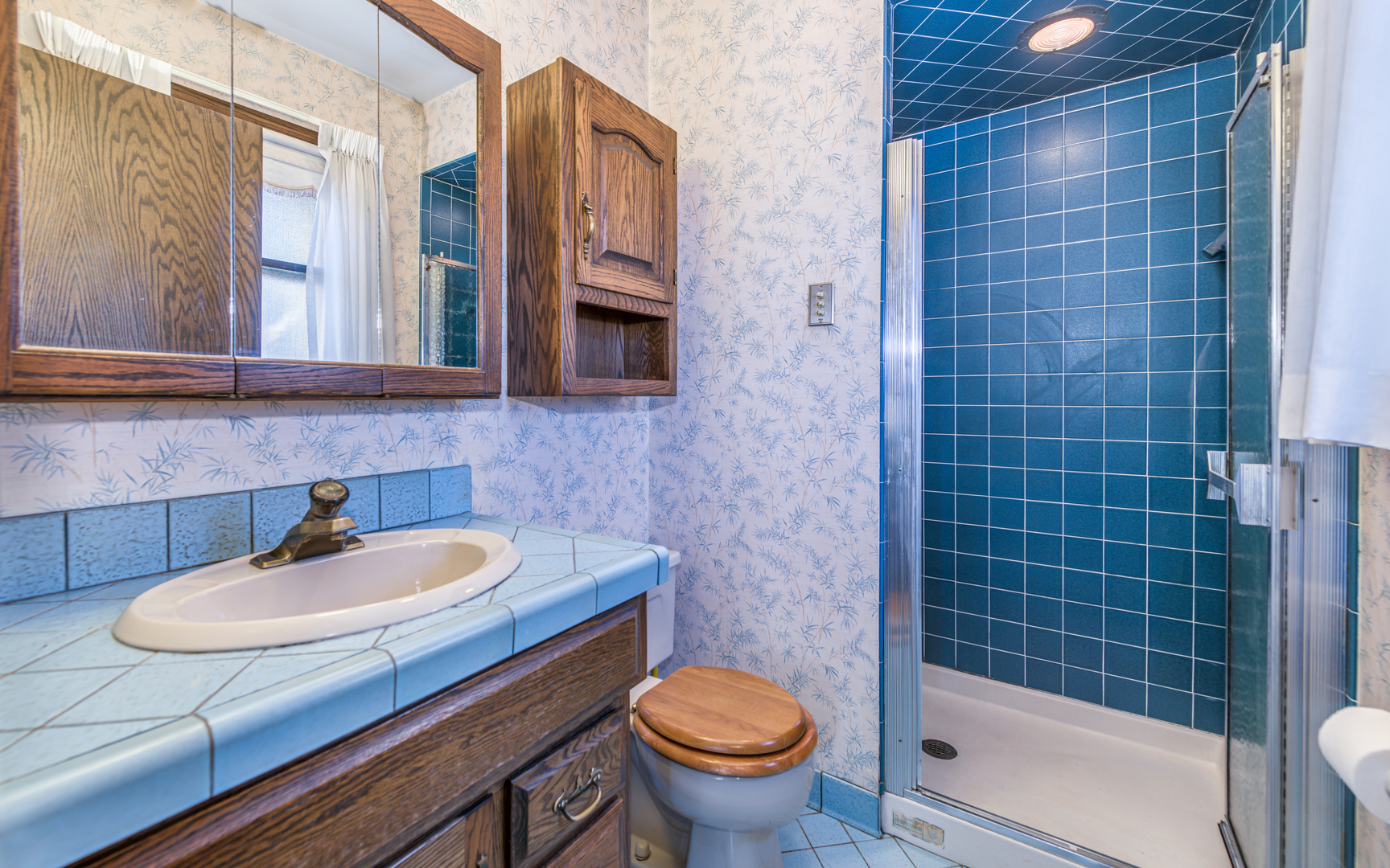 14400 Shepard Drive Dolton, IL 60419 - Photo 21 of 55 a bathroom with a sink a toilet and mirror
