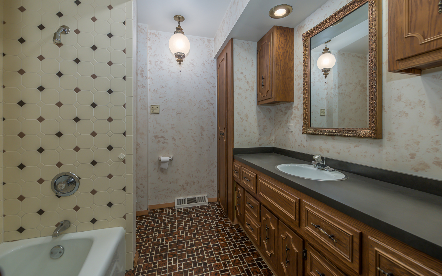 14400 Shepard Drive Dolton, IL 60419 - Photo 23 of 55 a bathroom with a sink a mirror and a shower