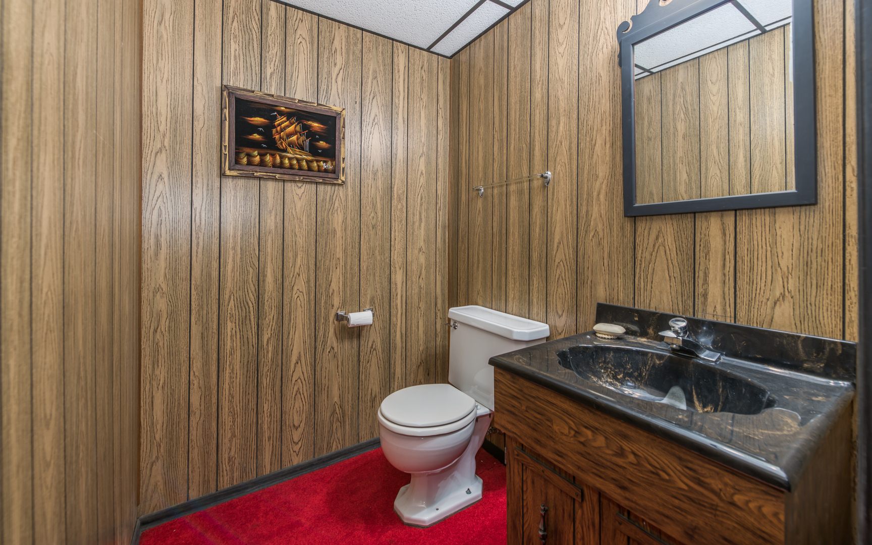 14400 Shepard Drive Dolton, IL 60419 - Photo 28 of 55 a bathroom with a sink a toilet and a mirror