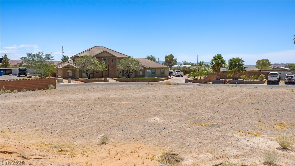 1141 Thomas Bay Circle Logandale, NV 89021 - Photo 12 of 16 This spacious property features a classic design with an expansive lot, offering ample outdoor potential.