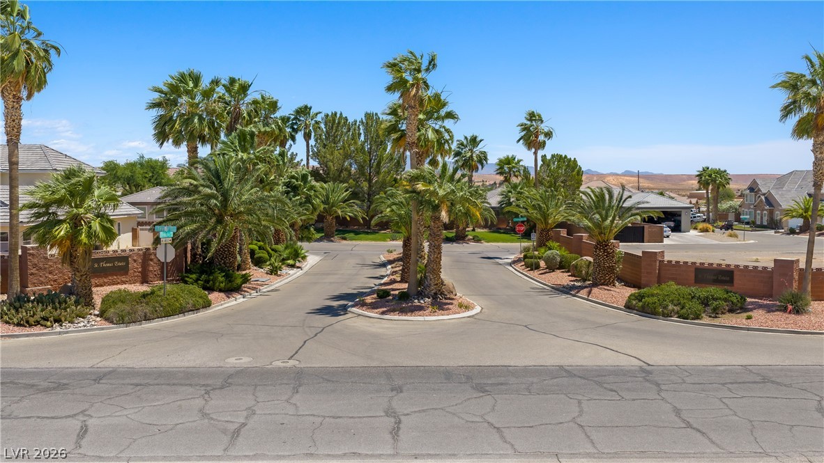 1141 Thomas Bay Circle Logandale, NV 89021 - Photo 3 of 16 Enter this vibrant community, where lush landscaping frames inviting residential streets.
