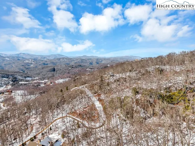 a front view of a building with sitting area