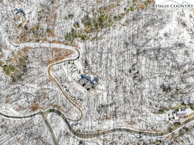 a view of field with trampoline in background
