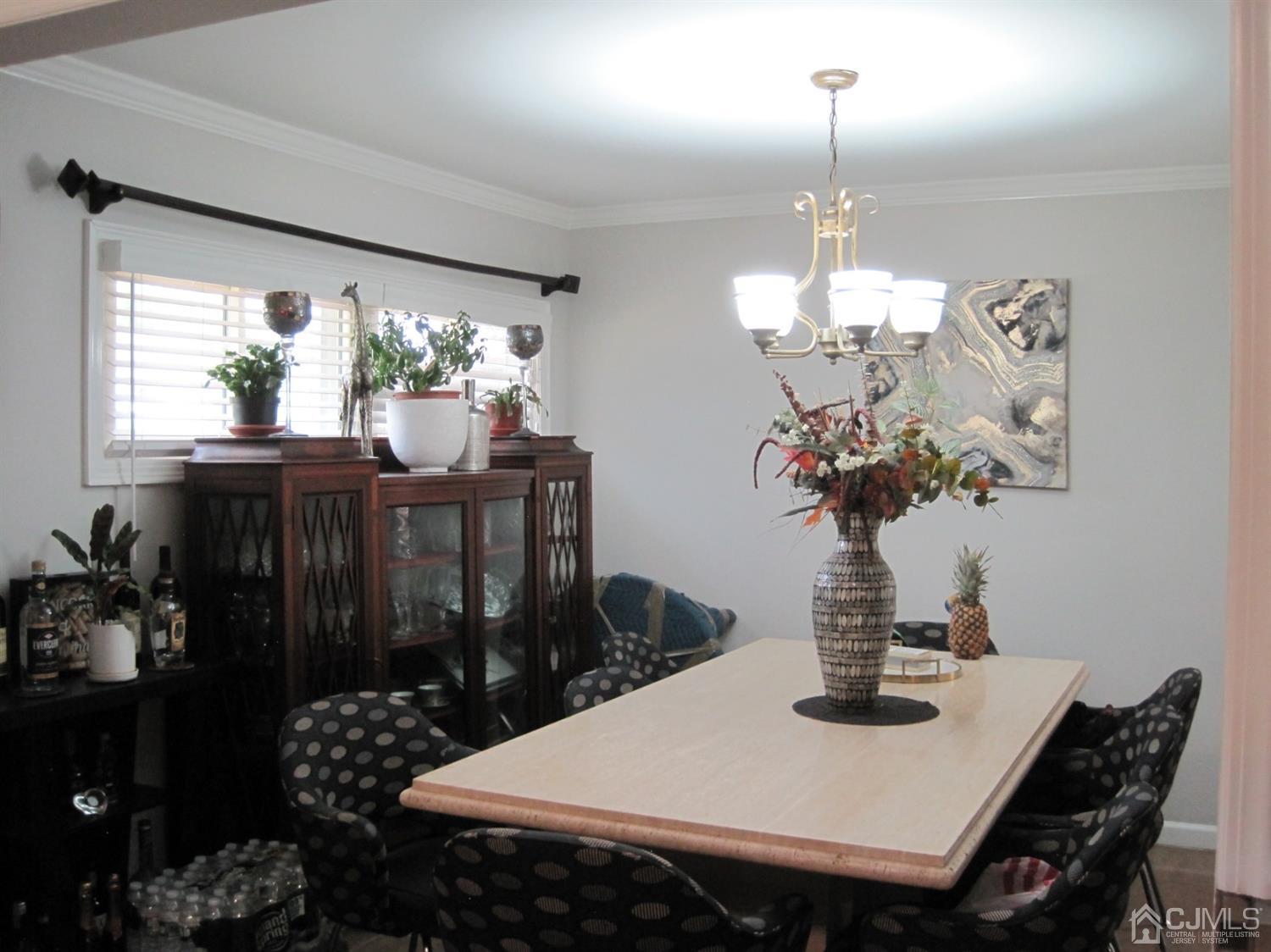 11 Pine Tree Road Old Bridge, NJ 08857 - Photo 5 of 12 a view of a dining room with furniture a chandelier and window