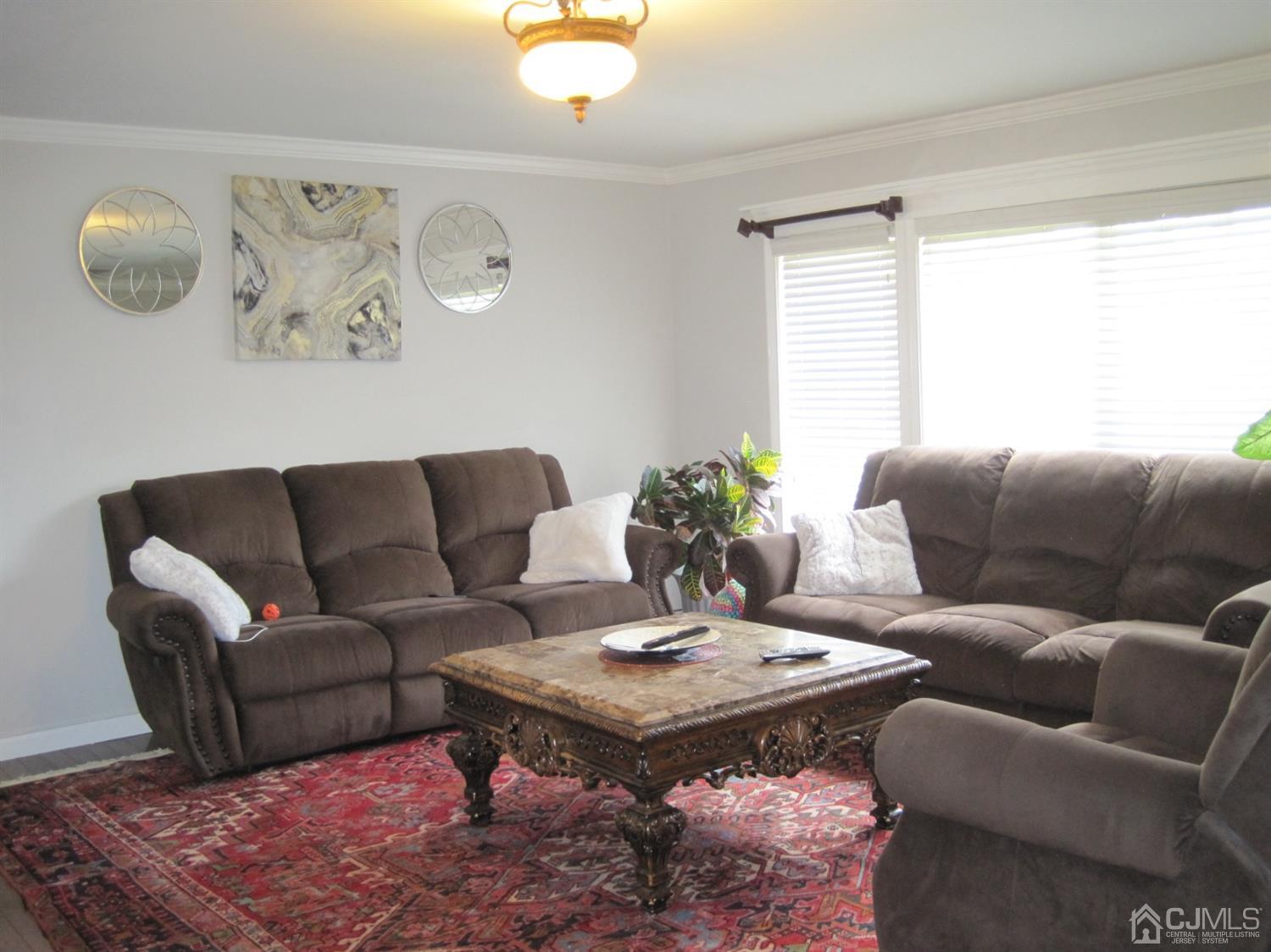 11 Pine Tree Road Old Bridge, NJ 08857 - Photo 7 of 12 a living room with furniture a rug and a window